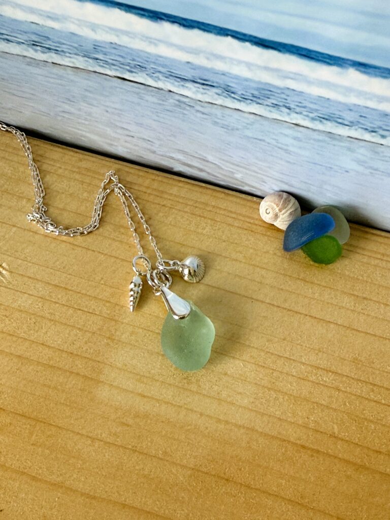 Hebridean Sea Glass pendant with silver shell charms and silver chain