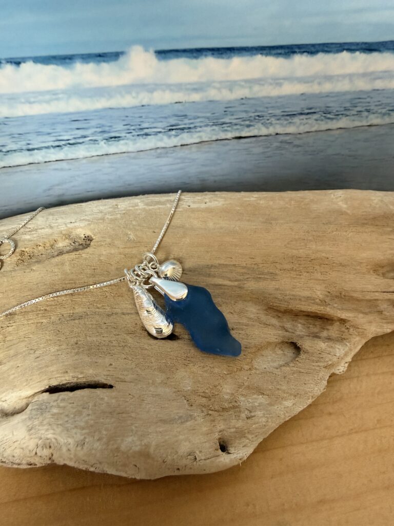 blue Sea Glass necklace with shells on sterling silver chain