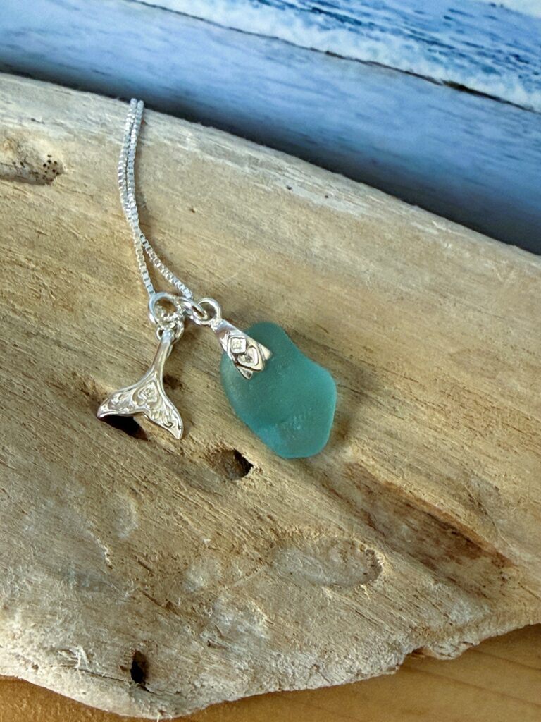 sea glass necklace with charm on a sterling silver chain