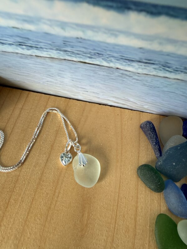sea glass pendant necklace with a sterling silver chain and aquamarine charm, handmade in Scotland