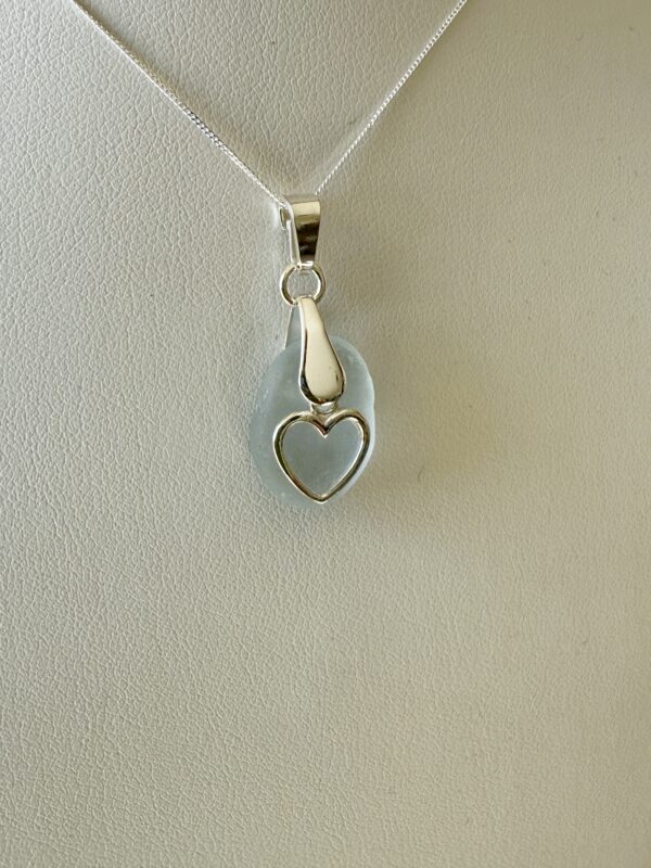 sea glass pendant necklace with a sterling silver heart charm on a sterling silver chain
