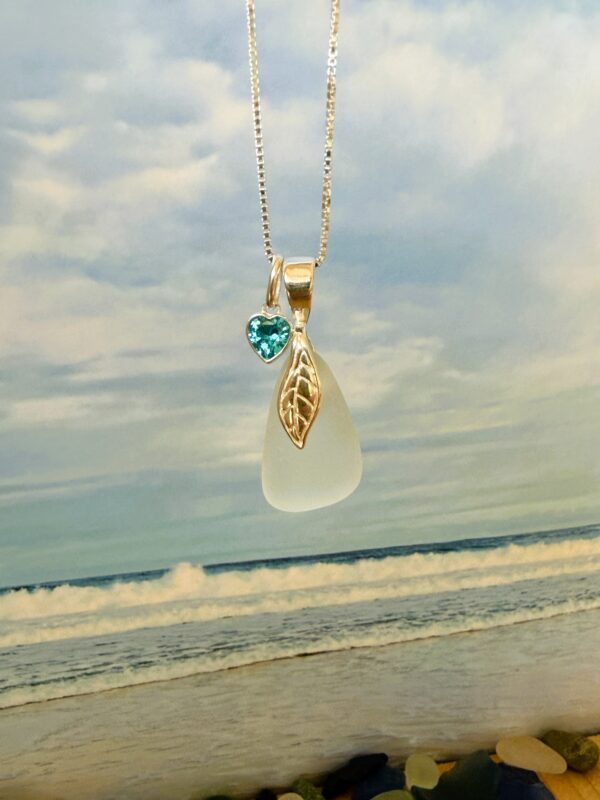 Hebridean Sea Glass pendant necklace with crystal heart charm on a sterling silver chain